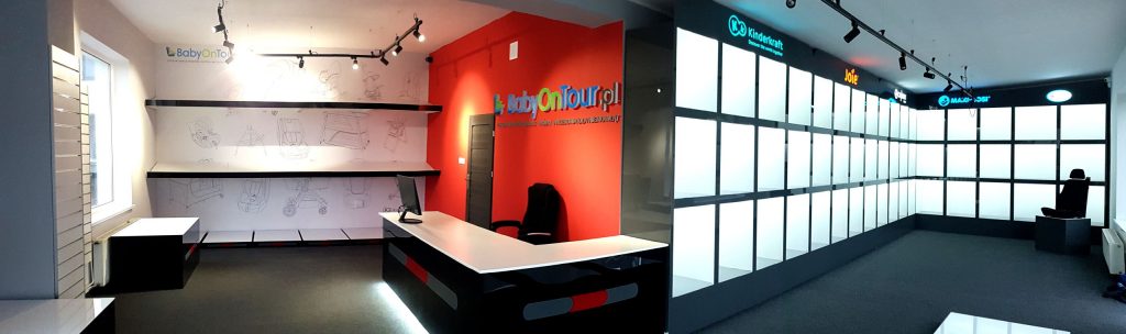 Panoramic shot of the interior of a furnished store.